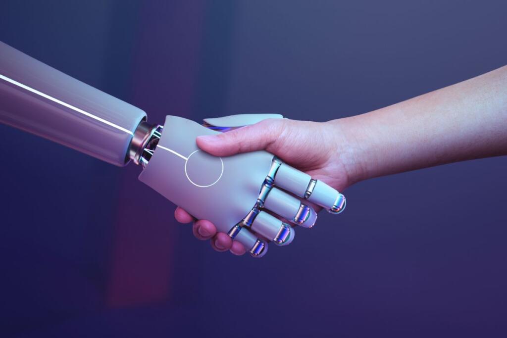 era digitale stretta di mano robot umano