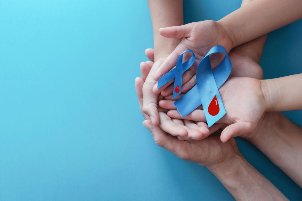 Nastri azzurri con sangue su sfondo blu, simbolo della Giornata mondiale del diabete