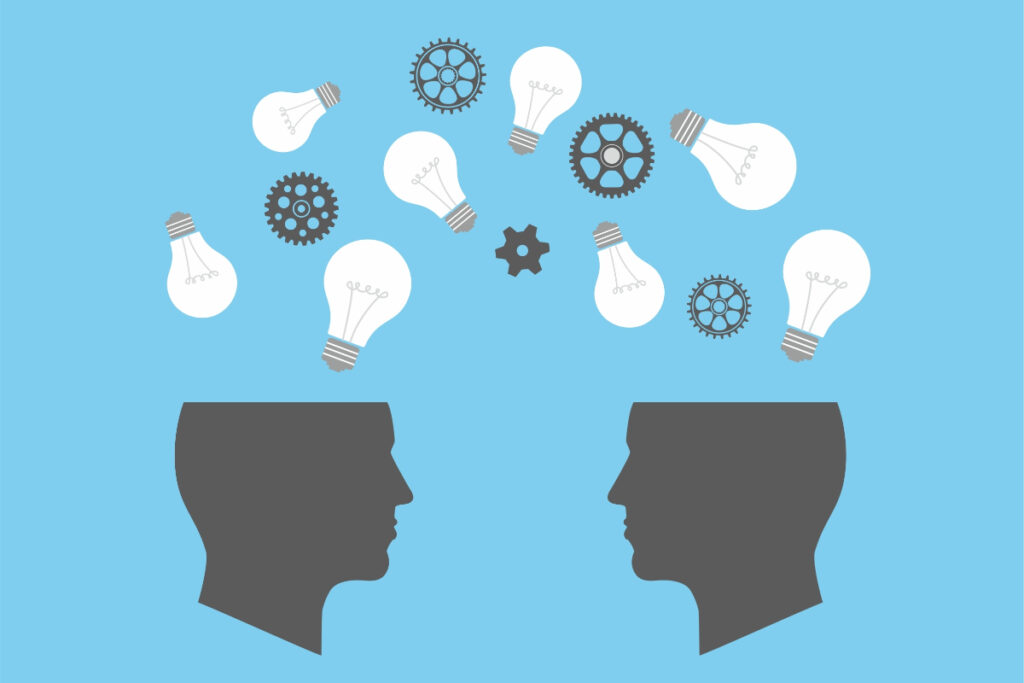 Illustrazione concettuale di intelligenza sociale con due menti stilizzate che condividono idee.